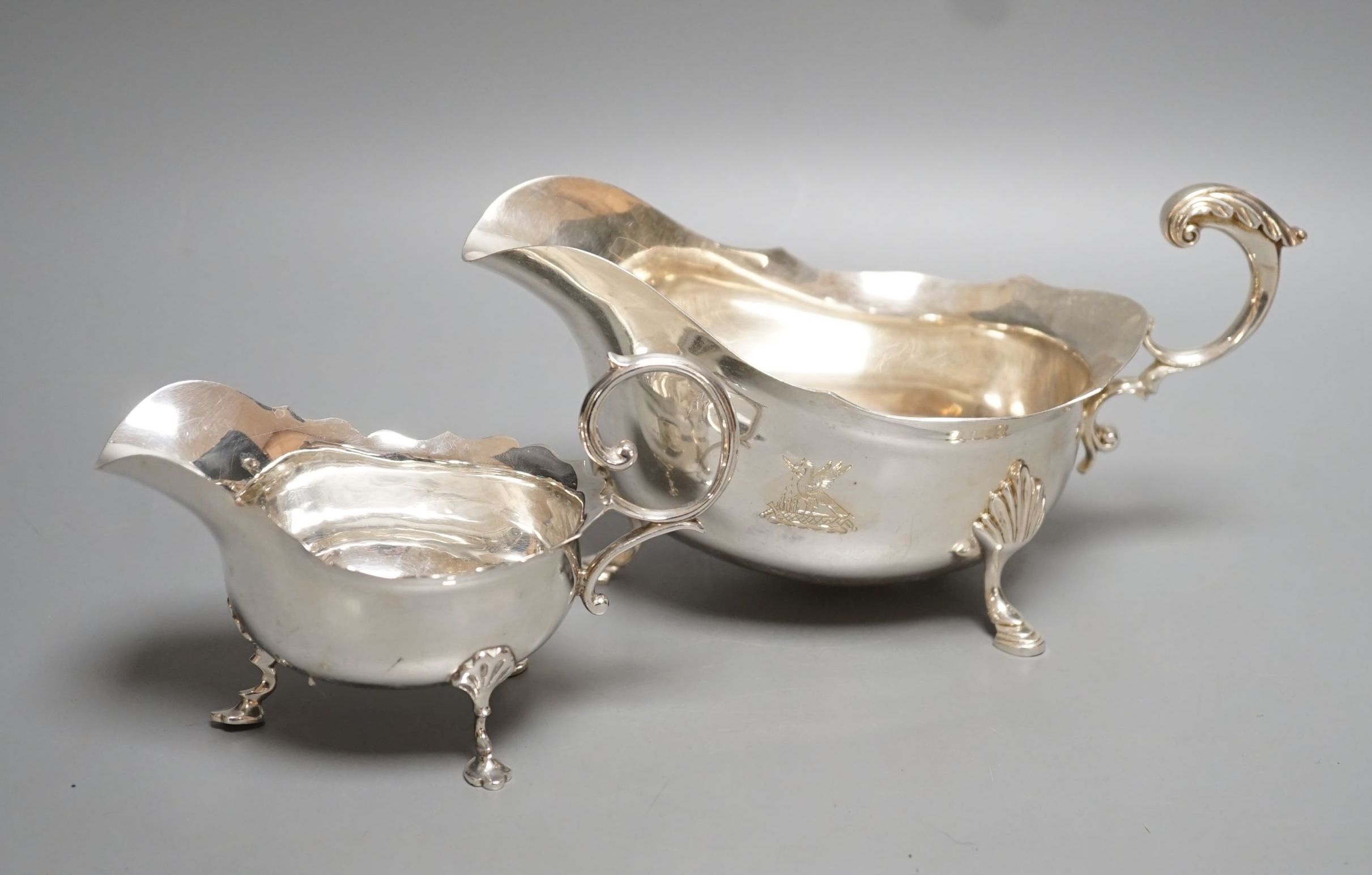 A modern silver sauceboat by Roberts & Belk and a smaller earlier silver sauceboat, 14.5oz.